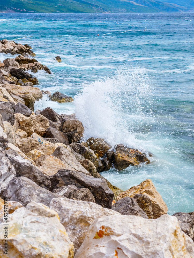 Waves on the beach with bays and rocks in Croatia Waves on the beach with bays and rocks in Croatia