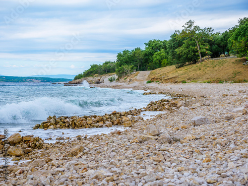 Fototapeta Naklejka Na Ścianę i Meble -  Waves on the beach with bays and rocks in Croatia