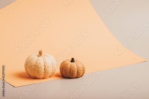 Flat lay with handmade painted gypsum pumpkins and copy space. Autumn holidays, thanksgiving, halloween geeting card, invitation mockup photo