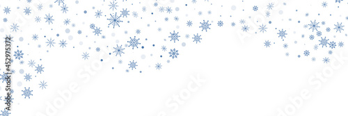 Blue delicate openwork snowflakes scatter on a white background. Festive background  postcard design  wallpaper