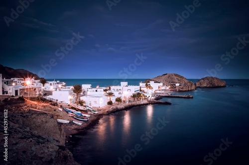 night view of the sea and the picturesque fishing village of Isleta del moro