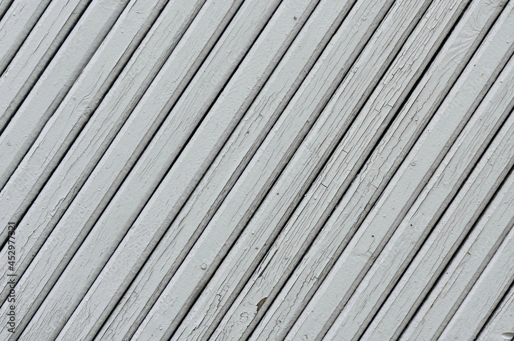 Fototapeta premium White cracked wood boards diagonal background.