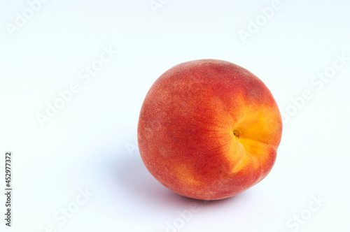 Red peach on light background