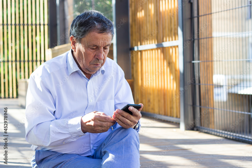 Senior man and his smartphone Senior man and his smartphone