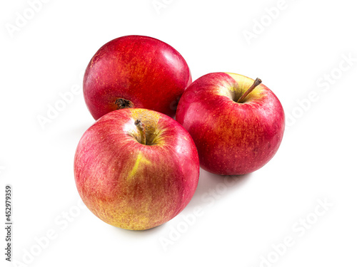 Three ripe red apples isolated on a white background