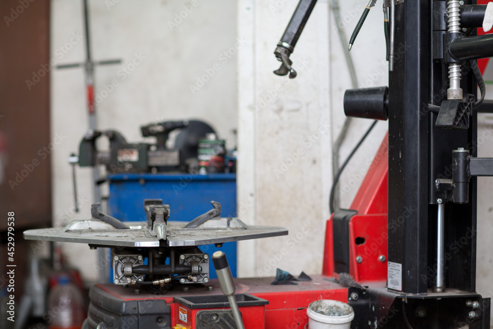 Machine for changing car tire fitting. Wheel tyre repairing Machine for changing car tire fitting. Wheel tyre repairing
