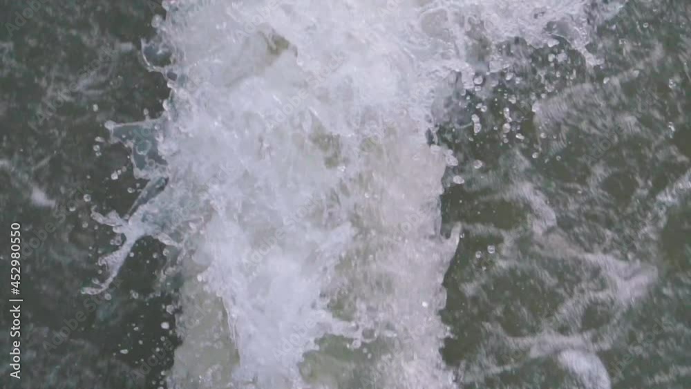 The backwash of a fast boat on the open ocean or lake. Dead Water of a boat in the tropical lake. The backwash of a fast boat on the open ocean or lake. Dead Water of a boat in the tropical lake.