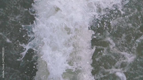 The backwash of a fast boat on the open ocean or lake. Dead Water of a boat in the tropical lake. photo