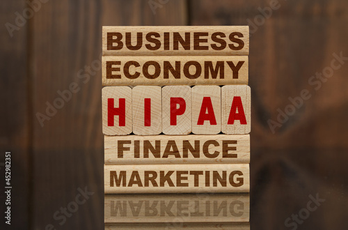 Wallpaper Mural Wooden blocks with the text - Business, Economy, Finance, Marketing and HIPAA Torontodigital.ca