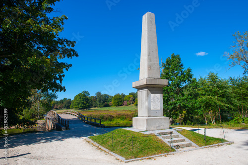 Historic Memorial obelisk in Old North Bridge park in Minute Man National Historical Park, Concord, Massachusetts MA, USA. photo