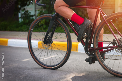 Close-up of a cyclist pedaling a bicycle.