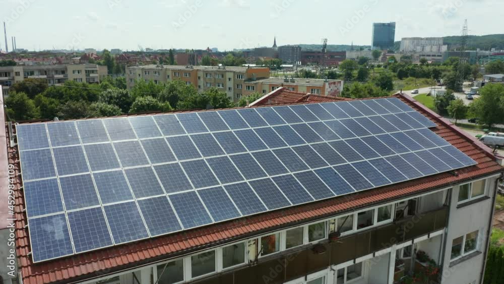 Aerial view of the farm of solar panels installed on the roof of an office building. Farm of solar panels. Concept of electricity, ecology, technologies. Aerial view of the farm of solar panels installed on the roof of an office building. Farm of solar panels. Concept of electricity, ecology, technologies.