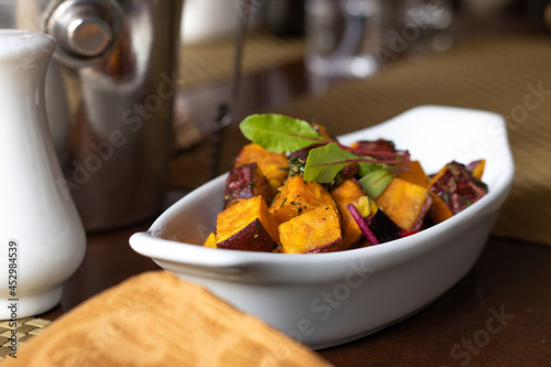 Peruvian food, Sweet Potato in pieces sautéed in oil. Tourist Restaurant of Peru. Latin, South American food. with sweet potato, potato and salad.