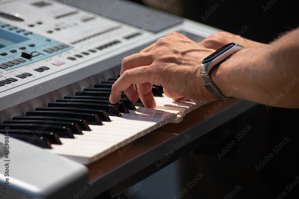 Fototapeta premium Pianist Play The Keys Of The Electronic Piano