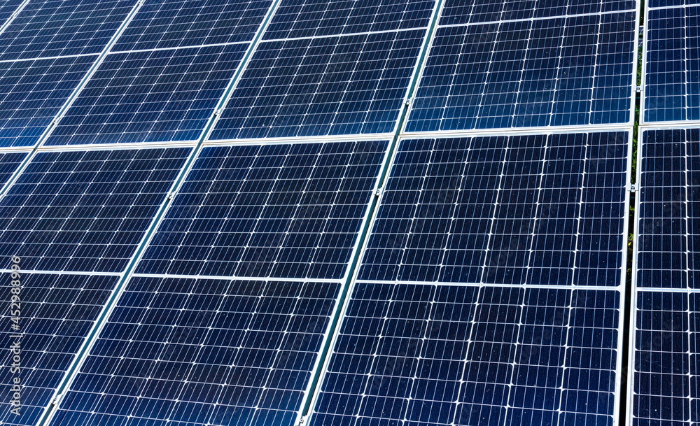 solar panels installed on the ground produce environmentally friendly energy in summer solar panels installed on the ground produce environmentally friendly energy in summer