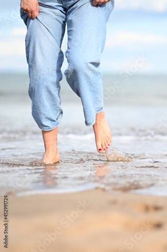 bare feet walking on the beach © Sebastian