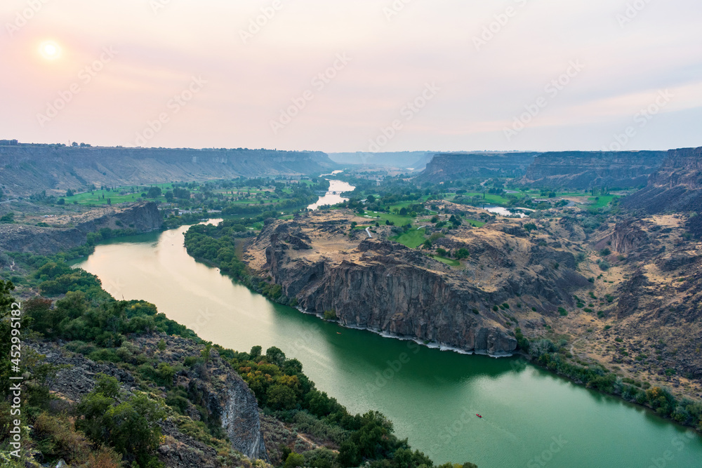 Wildfire smoke hovers over Snake River Canyon near Twin Falls, Idaho during sunset