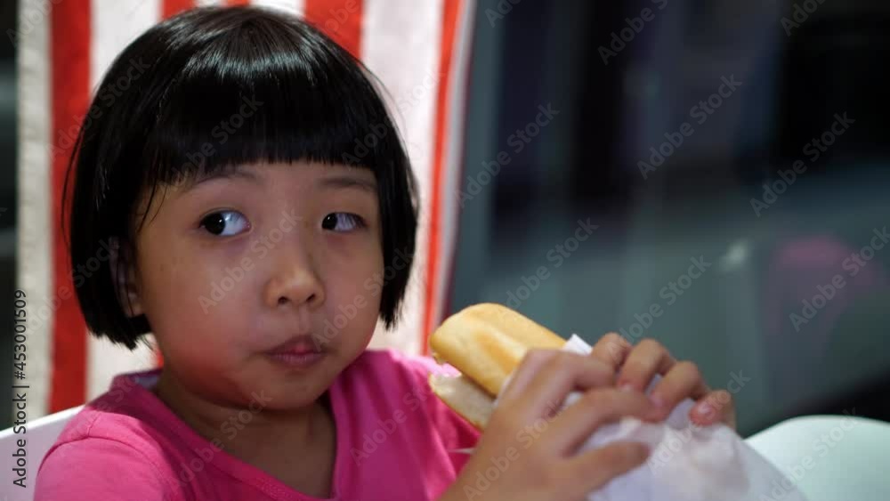 Asian girl eat the bread at restaurant Asian girl eat the bread at restaurant