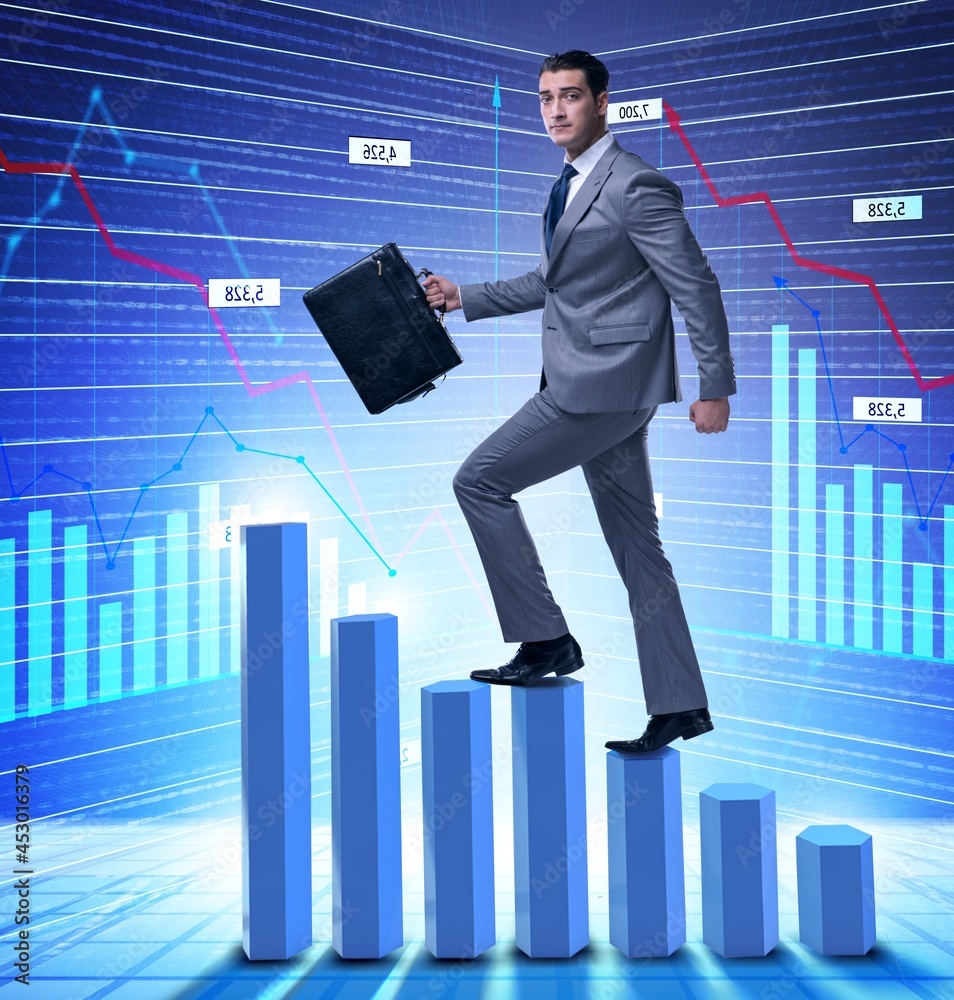 Businessman climbing bar charts in business concept Businessman climbing bar charts in business concept
