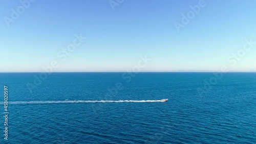 Wallpaper Mural A speedboat is driving on the deep blue sea. Tracking shot Torontodigital.ca