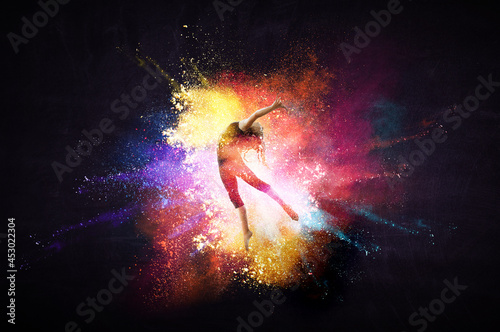 Female dancer against abstract colourful background © Sergey Nivens