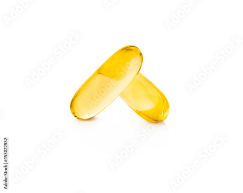fish oil supplement capsules higher vitamin and omega-3 in selective focus isolated on white background