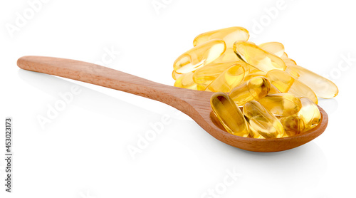 Obraz na płótnie Fish oil capsules in a spoon w salonie