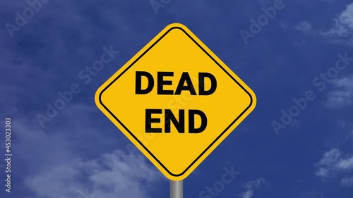 Dead End Road Sign on Clear Blue Sky with Rapid Moving Clouds