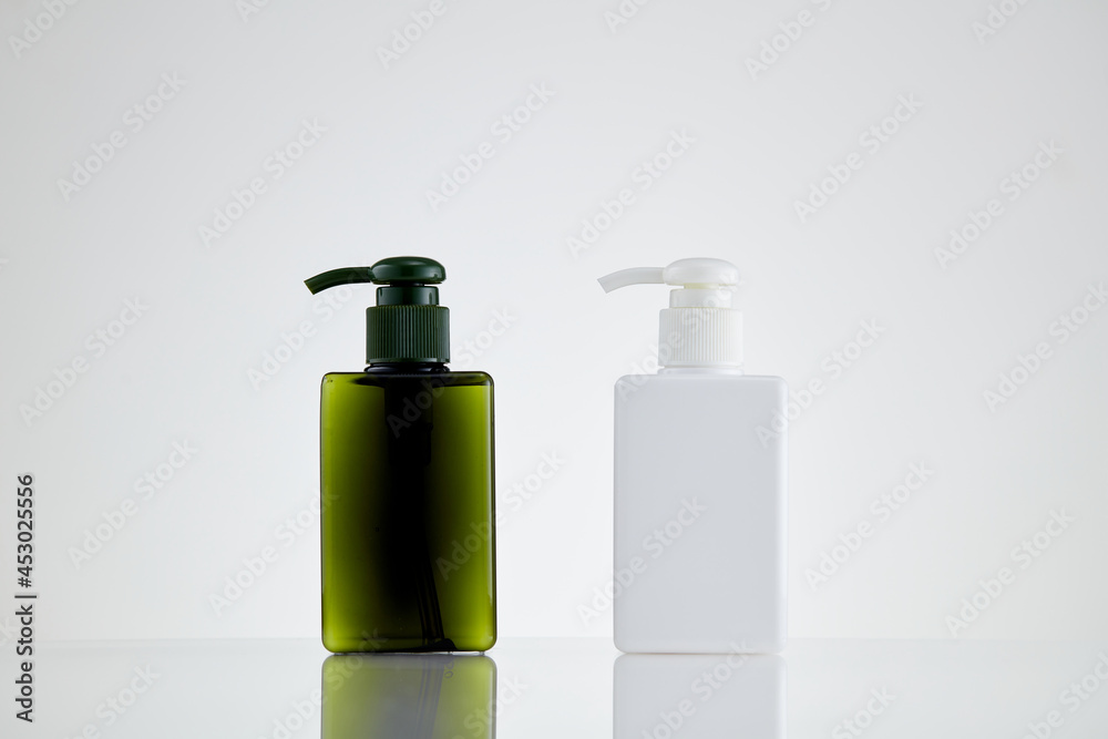 Blank cosmetics packaging mockup.  Bottle with press pump