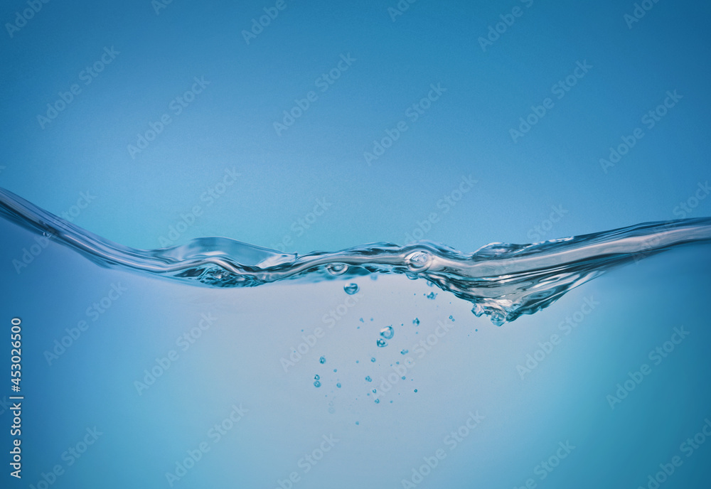Blurred beautiful swaying water waves splashing water waves in clean blue water. Blurred beautiful swaying water waves splashing water waves in clean blue water.