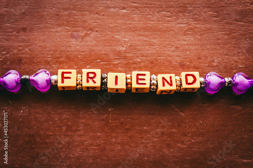 Friendship band with word friend featuring each alphabet with in a cube format. Band for friendship photo