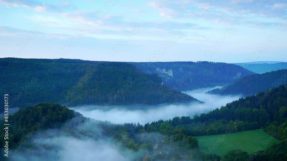 Clouds flowing slowly among green mountains Clouds flowing slowly among green mountains
