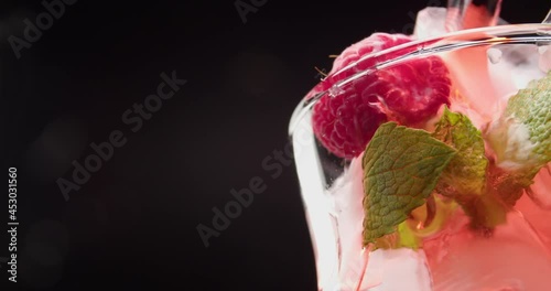 Wallpaper Mural Pouring of tasty raspberry lemonade in glass on dark background, closeup Torontodigital.ca