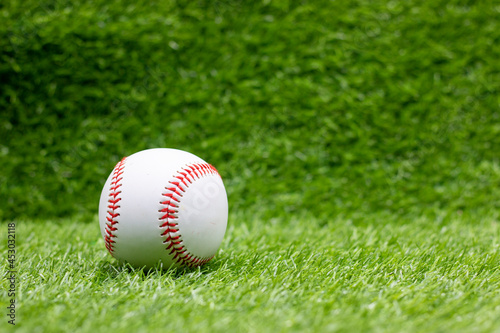 Baseball is on green grass