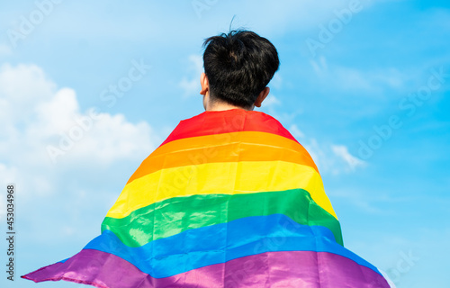 Abstract silhouette of gay man on shoulder is lgbt flag