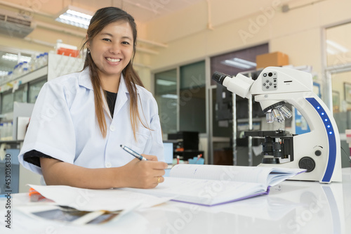 Picture of the scientist working in the laboratory and smiling, Concept science and technology, Science background