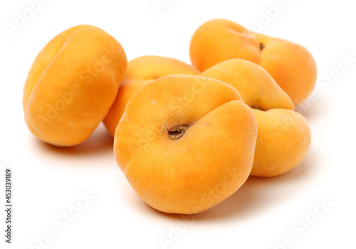 chinese flat peaches on white background 