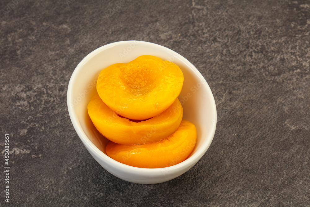 Marinated peaches fruit in the bowl Marinated peaches fruit in the bowl