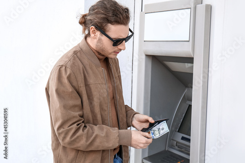 Man withdrawing money from ATM
