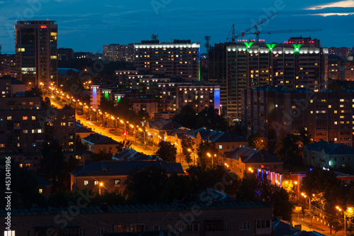streets of the night city in orange lanterns © Дмитрий Солодянкин