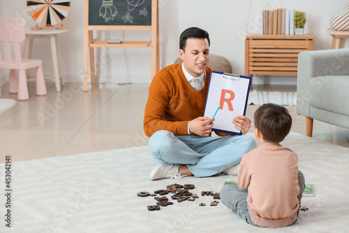Speech therapist working wi...