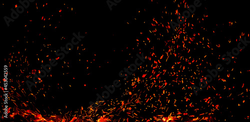 Sparks from fire on a black