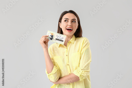 Young woman with gift certi...
