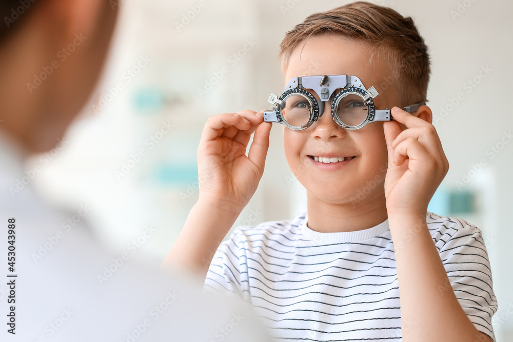 Little boy undergoing eye test in clinic Little boy undergoing eye test in clinic