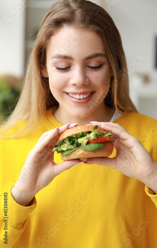 Young woman with tasty vega...