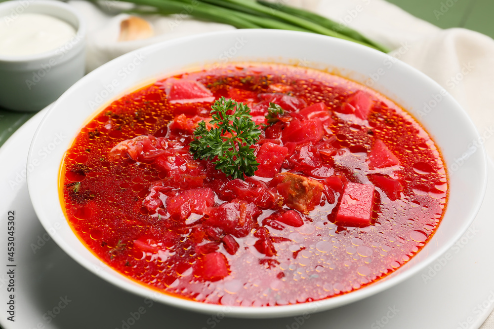 Bowl with tasty borscht on table Bowl with tasty borscht on table
