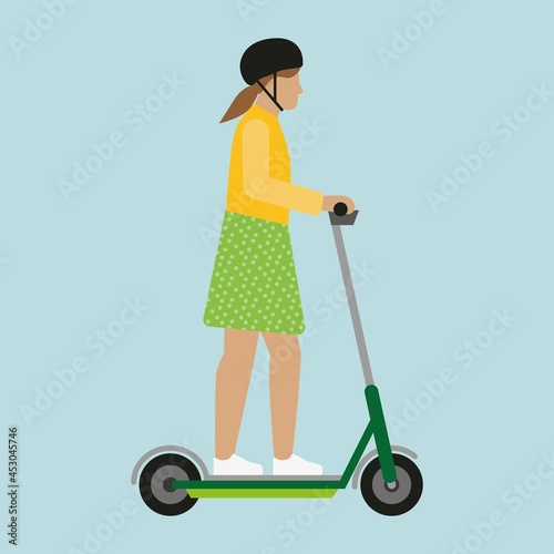 Girl  with helmet on an electric scooter.