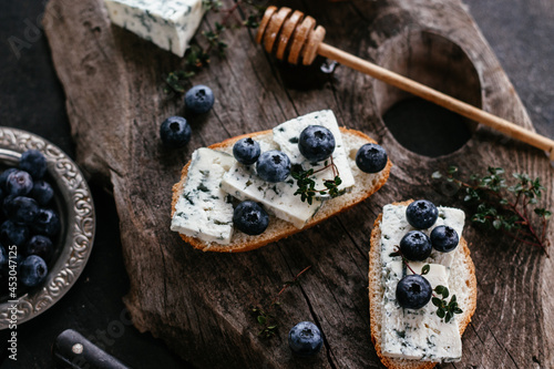 sandwiches with blueberry cheese and honey