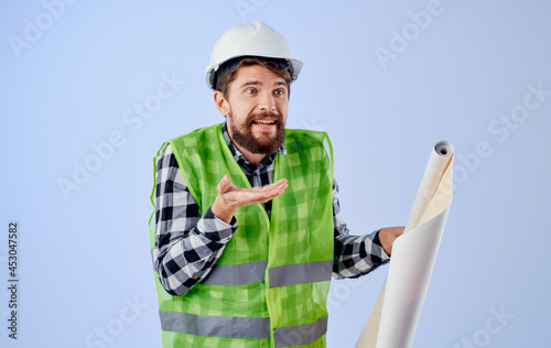 man in construction uniform helmet construction technology blueprints blueprints