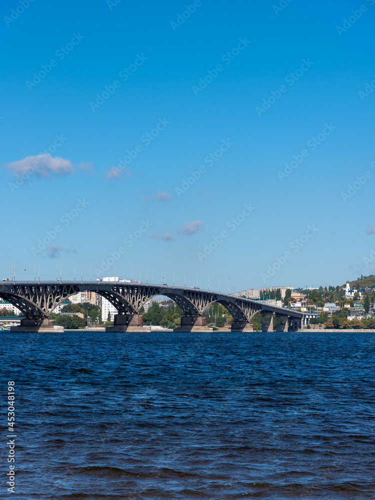 View of the big bridge over the Russian Volga river and the bank of the city of Saratov